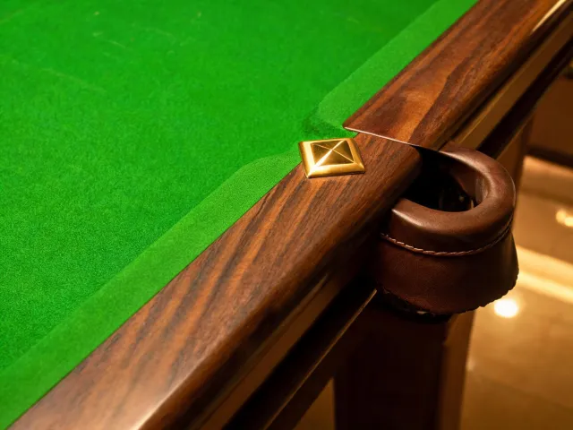 Green cloth and walnut table